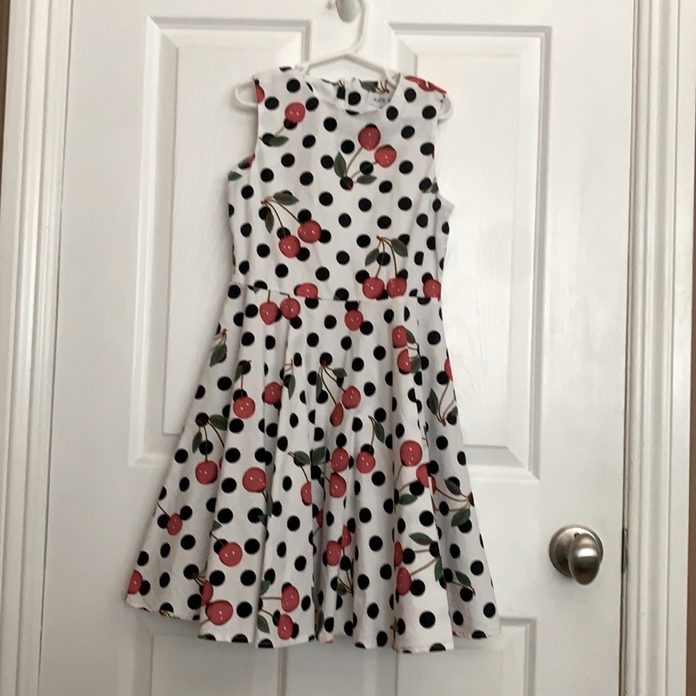 White dress with black polka dots and red cherries